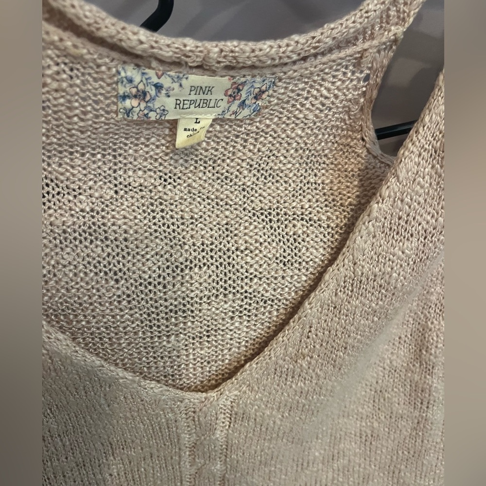 Peek a boo shoulder blouse. Pale pink sweater